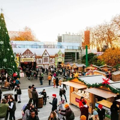 The Seattle Christmas Market during daylight with customers.