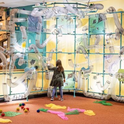 Seattle Children's Museum girl plays in interactive exhibit.