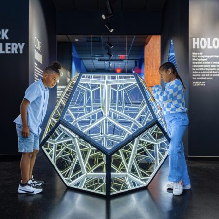 Kids in front of piece at The Museum of Illusions in Seattle.