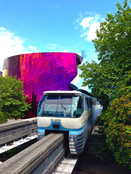 Seattle Monorail Blue Train in front of the Museum of Pop Culture.