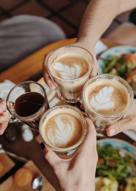 Coffee cheers over table.