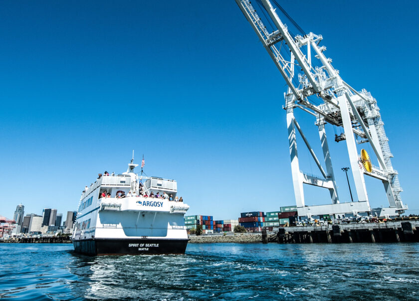 Argosy Cruises Spirit of Seattle boat on Elliot Bay by crane.